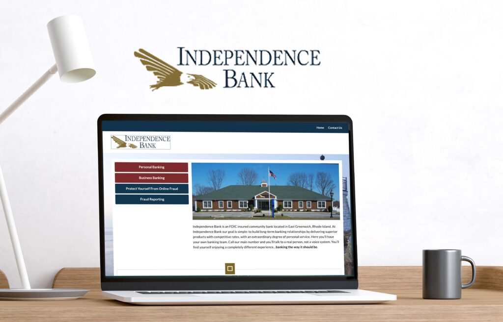A laptop displays the homepage of the Independence Bank website