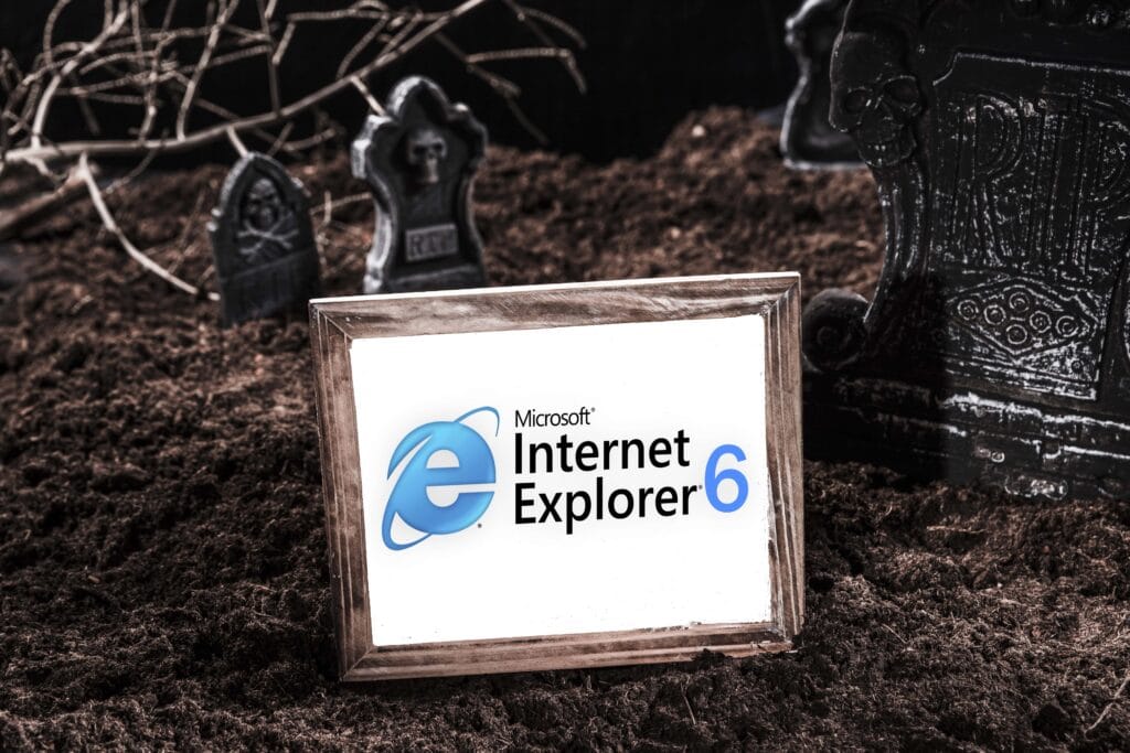 A distressed picture frame of the internet explorer logo version 6 in a graveyard
