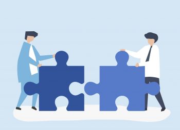 An illustration of two people, represented by two puzzle pieces, trying to connect