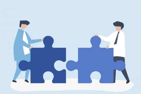 An illustration of two people, represented by two puzzle pieces, trying to connect